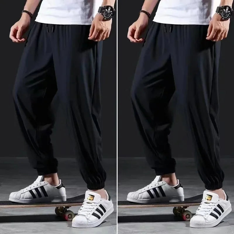 Summer Quick-drying Ice Silk Casual Pants Men's Ultra-thin Elastic Nine-point Pants Loose Drape Solid  Beam Feet Pants 7XL